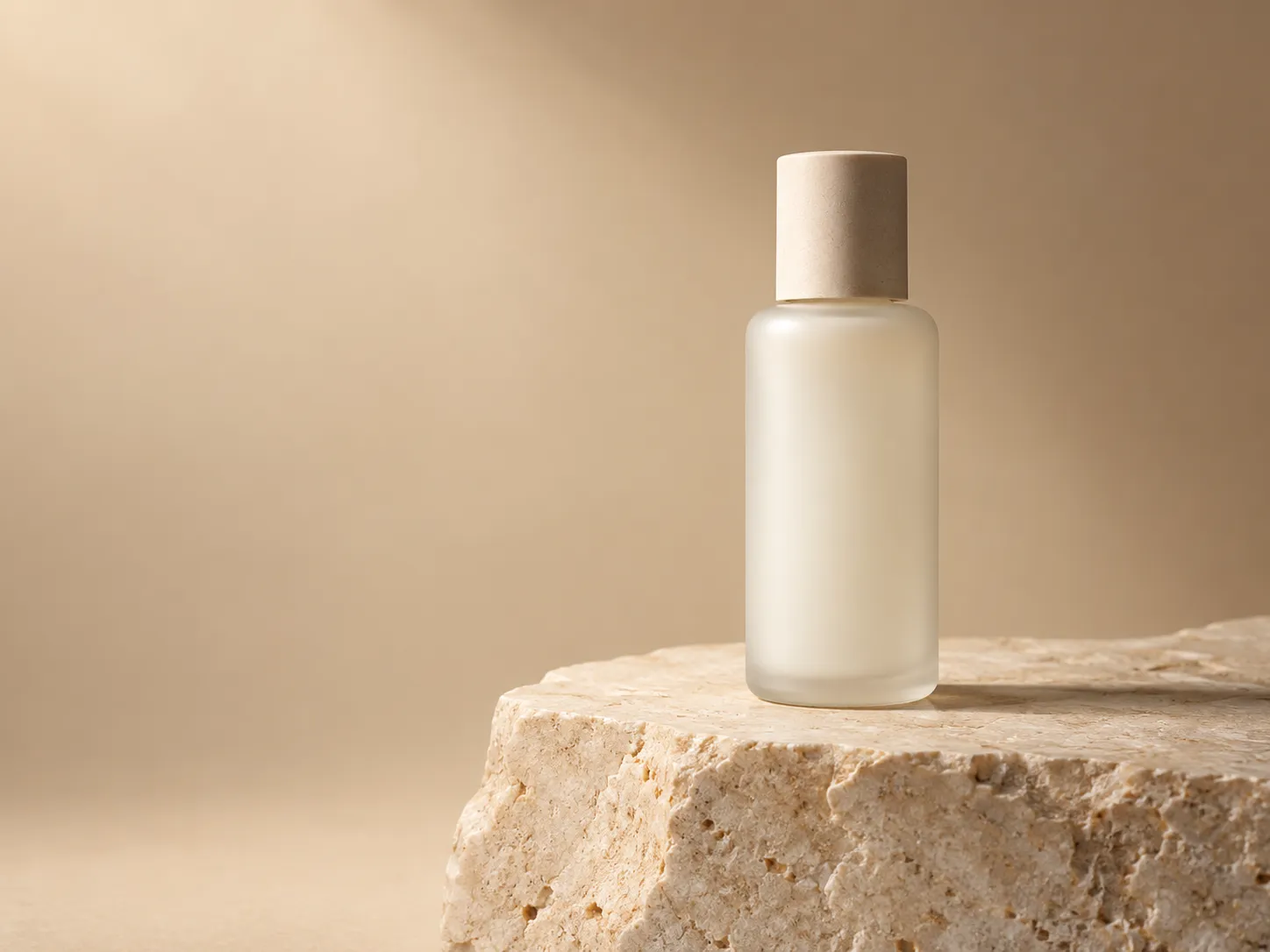 Minimal product post with a skincare bottle on a pale plinth