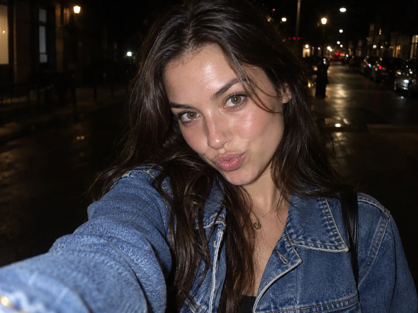 Night selfie with direct on-camera flash on a dark street