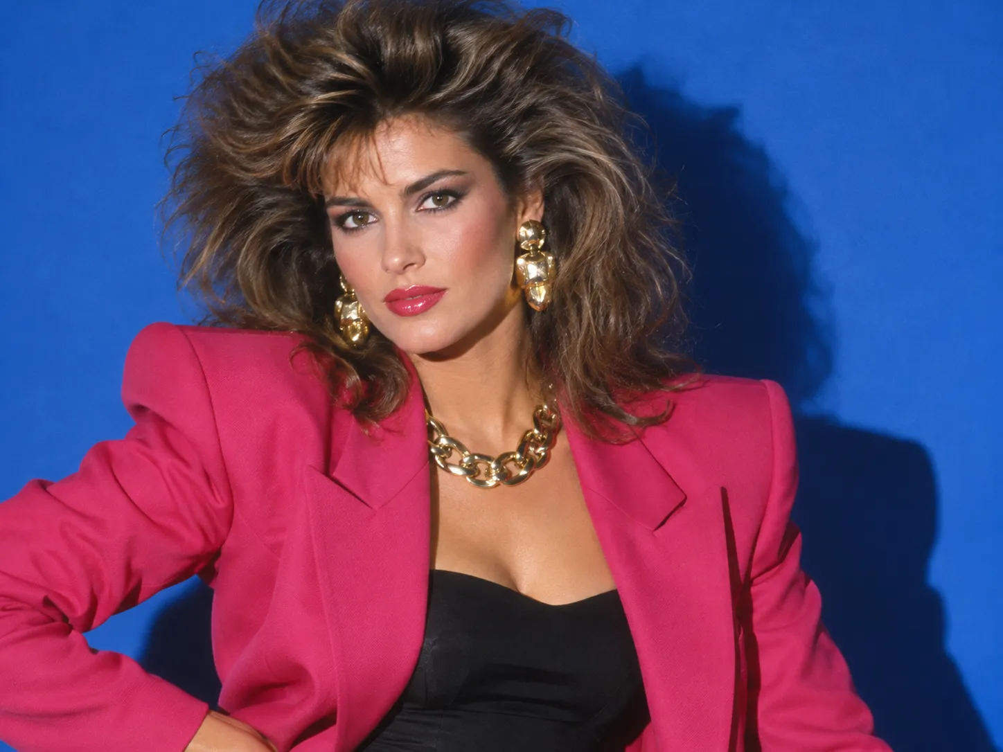 1980s editorial portrait with bold hair and direct flash